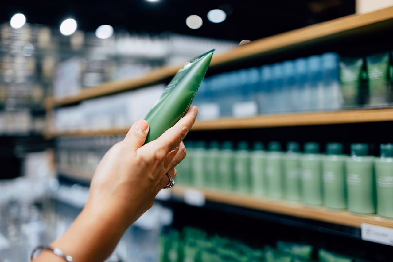 A Close Up View Of An Unrecognizable Female’s Hand Holding Some Beauty Product